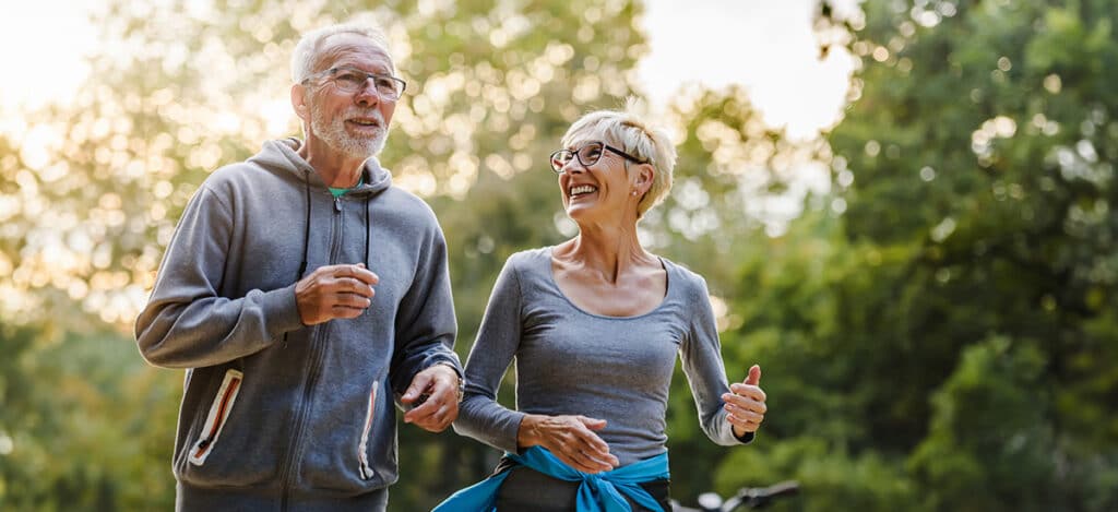 Healthy mature couple going for a jog together