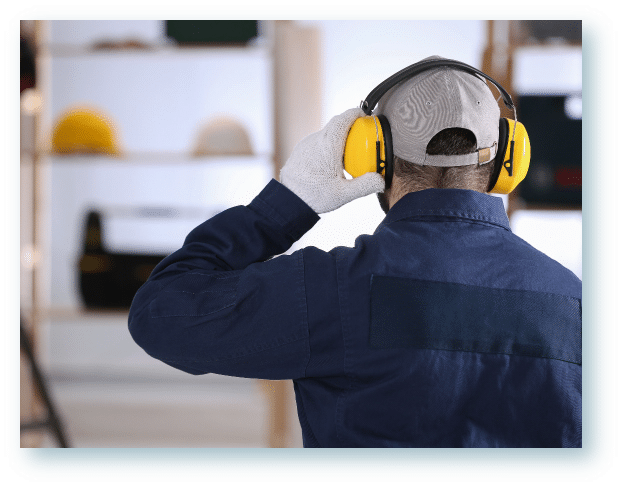 Man working in construction wearing hearing protection to protect his ears